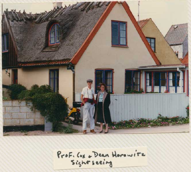 Professors Cox and Dean Horowitz posing in front of a house in Copenhagen