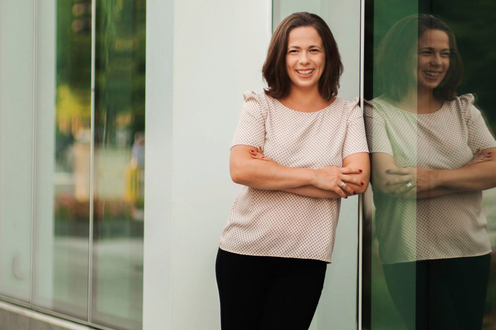 Photo of woman leaning against window